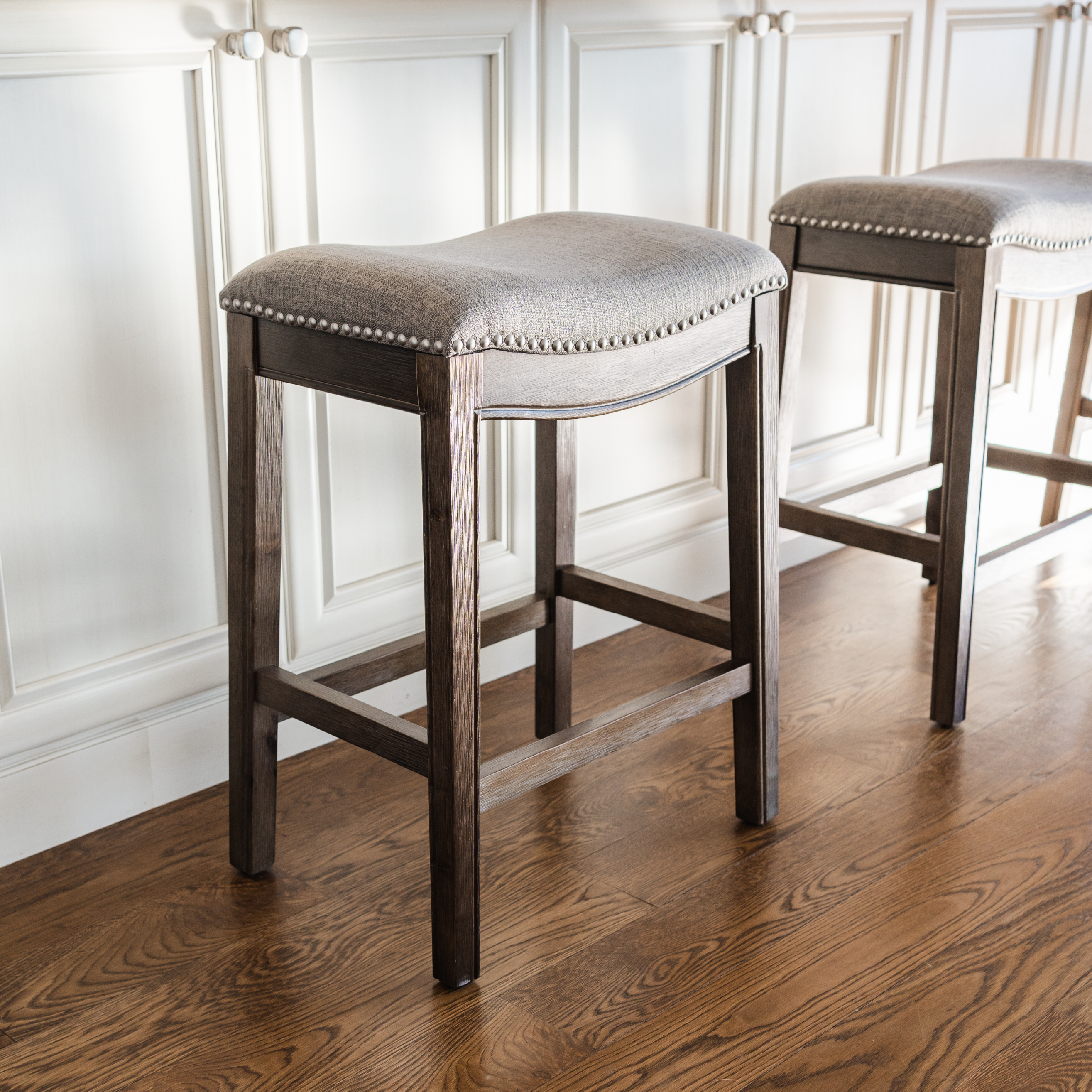 26" Adrien saddle counter height kitchen stool - walnut finish with grey fabric upholstery in Stools by Maven Lane