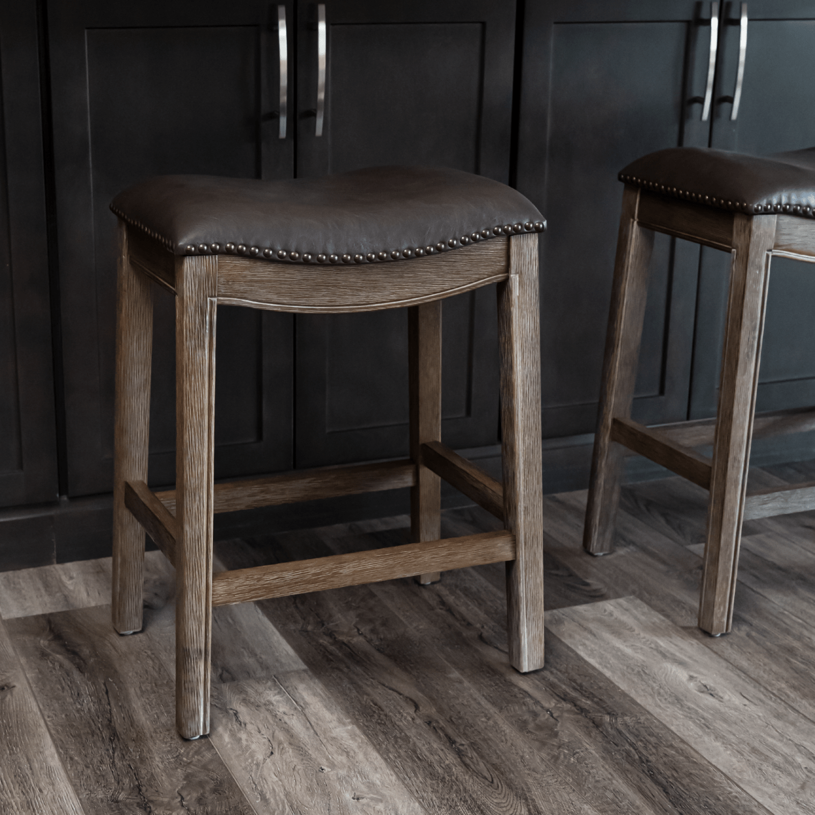 26" Adrien Saddle Counter Stool in Brown Finish with Dark Brown Faux Leather (Set of 3) in Stools by Maven Lane