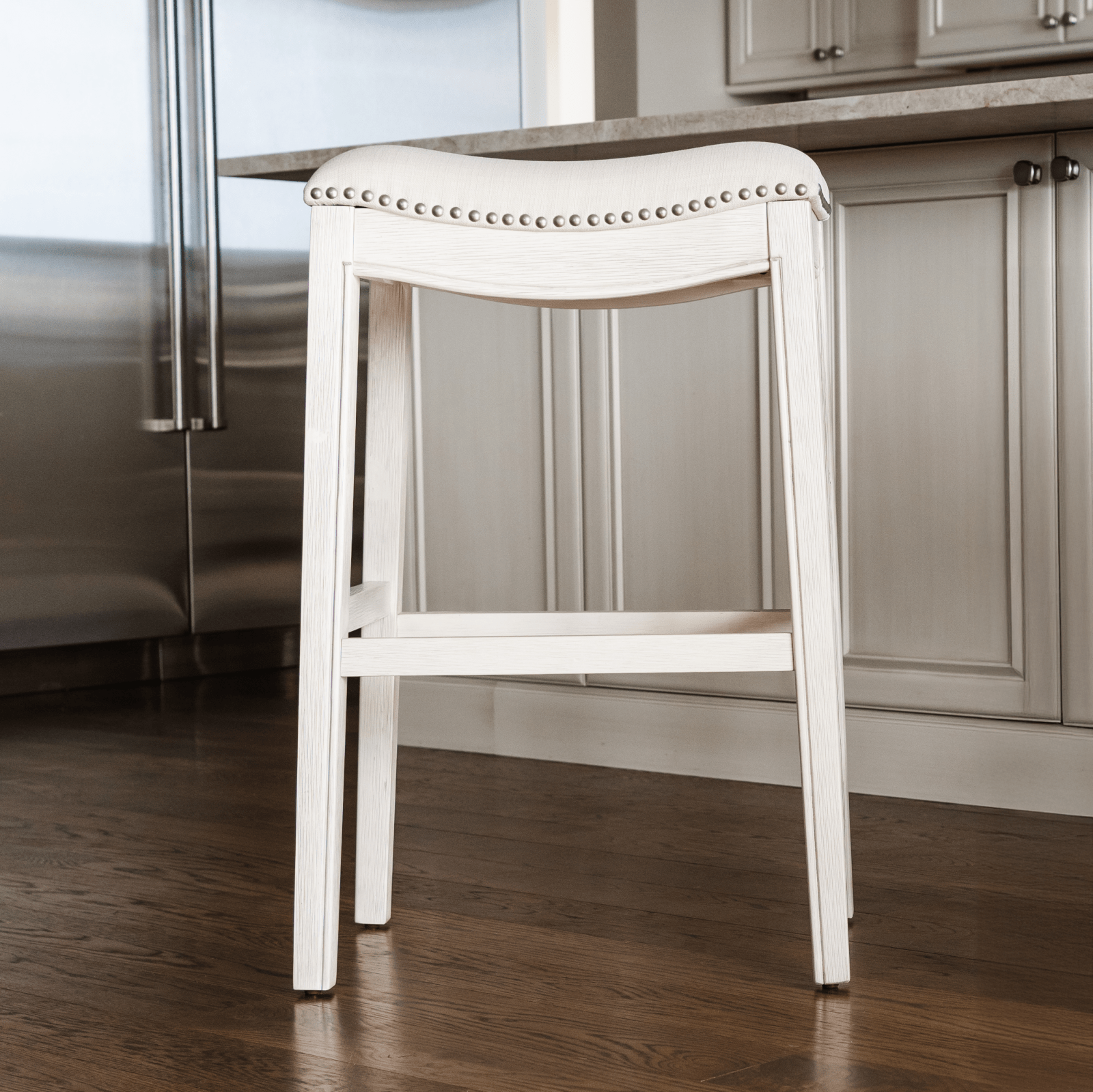 Adrien Saddle Bar Stool in Cream Finish and Cream Fabric in Stools by Maven Lane