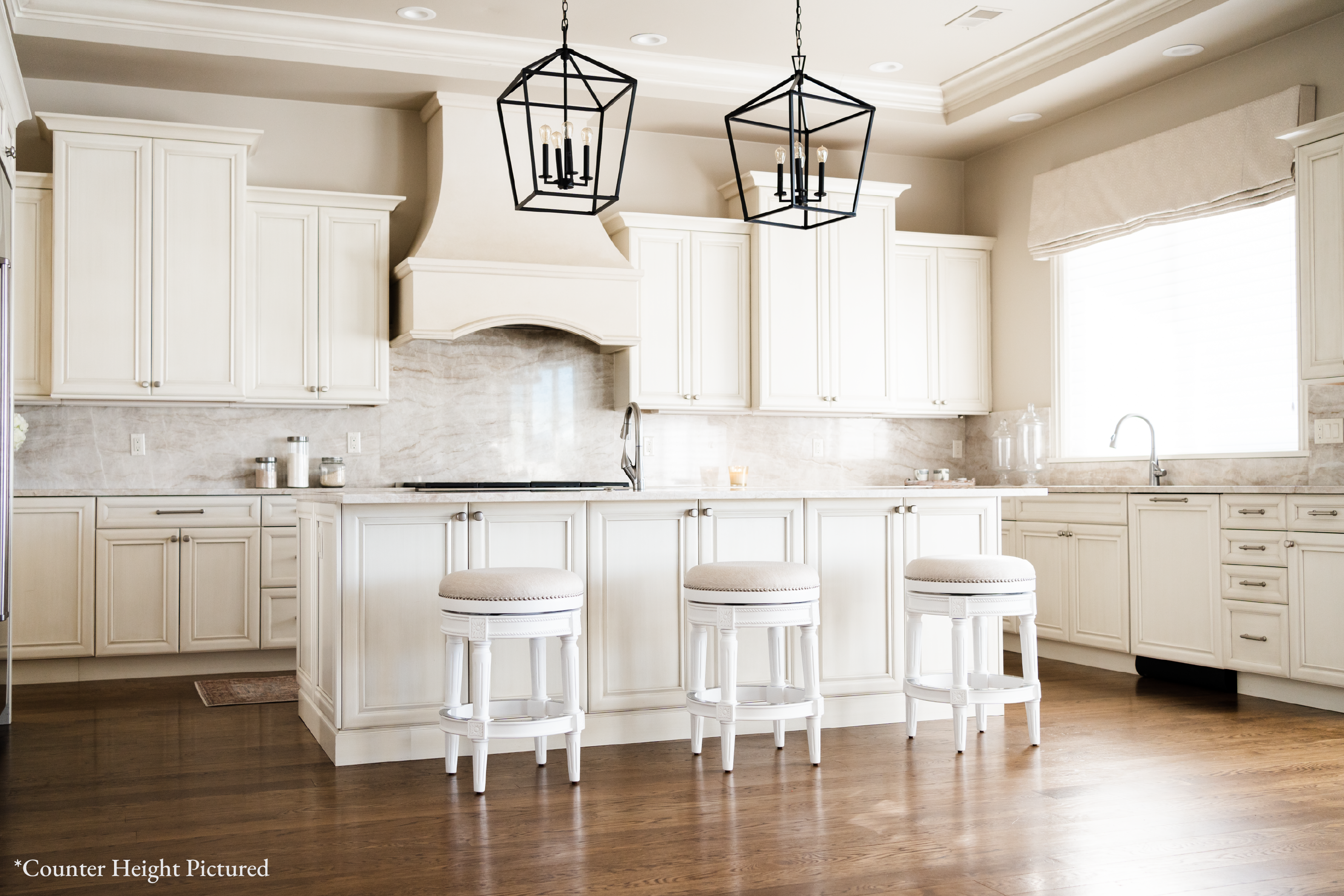 31" Pullman backless swivel bar stool in alabaster white finish with cream fabric upholstery in Stools by Maven Lane