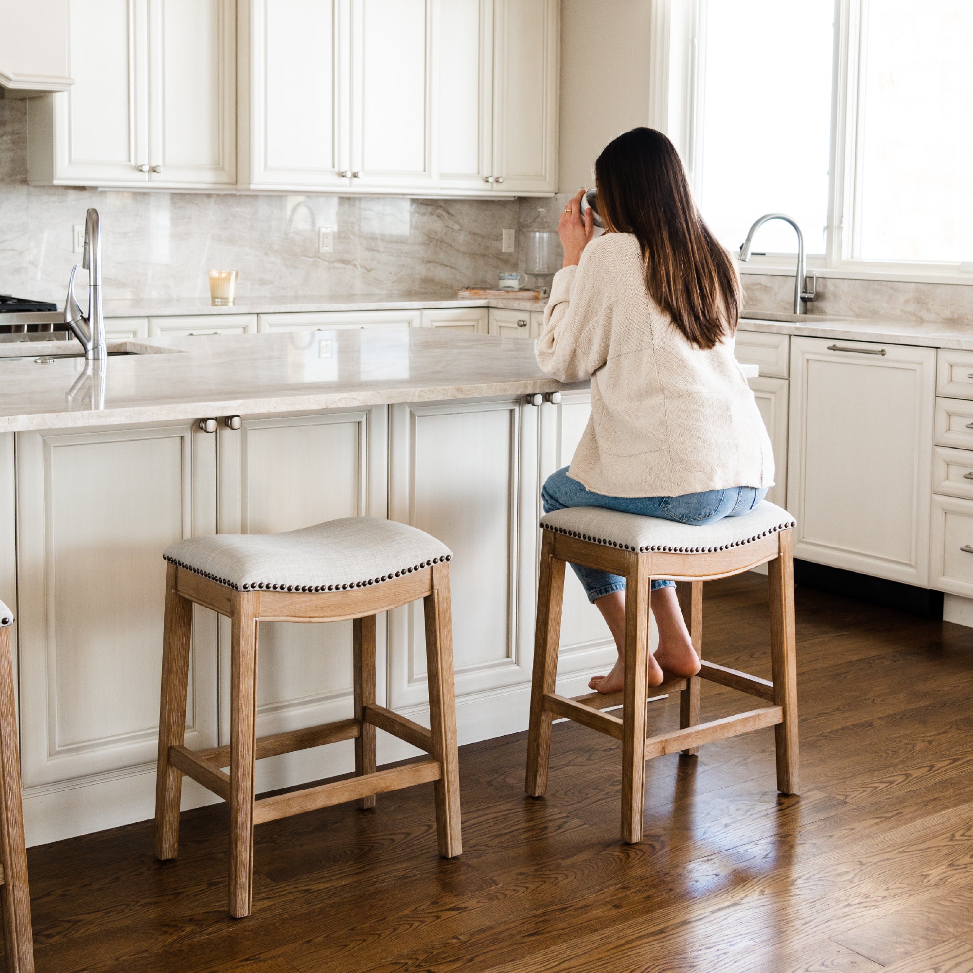 26" Adrien Saddle Counter Stool in Weathered Oak Finish with Sand Color Fabric Upholstery in Stools by Maven Lane