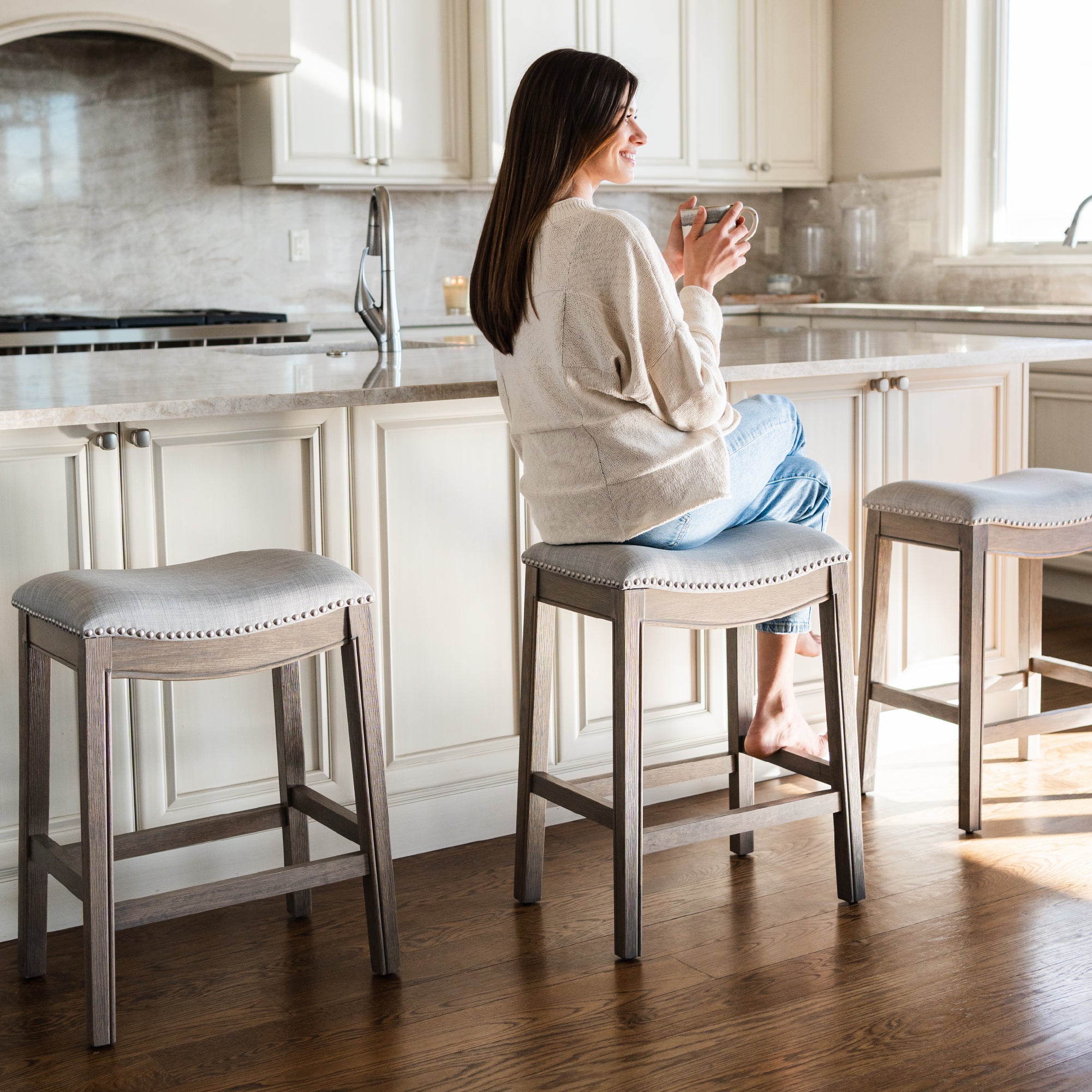 26" Adrien Saddle Counter Stool in Reclaimed Oak Finish with Ash Grey Fabric Upholstery in Stools by Maven Lane
