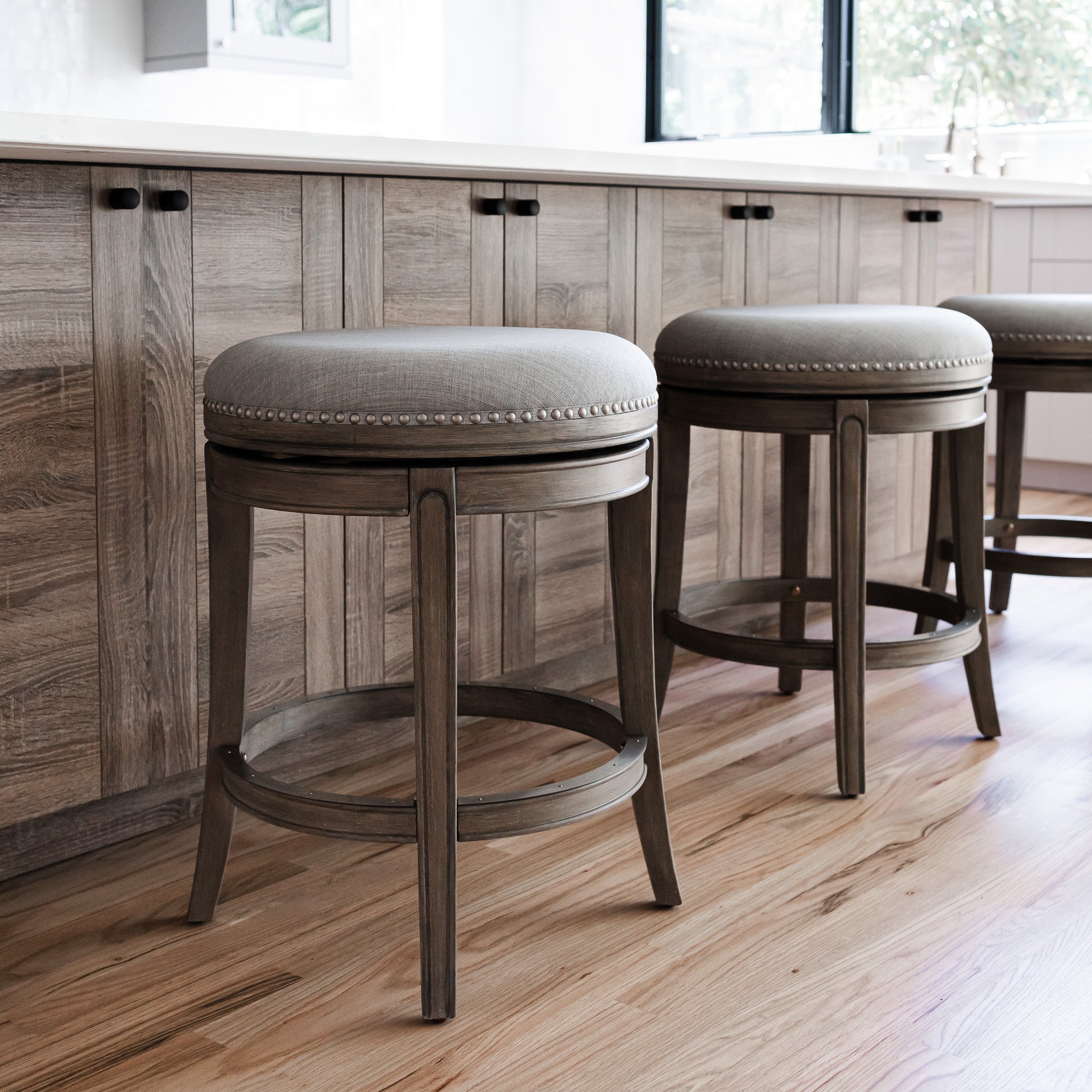 26" Alexander Backless Counter Stool in Grey Finish with Grey Fabric Upholstery (Set of 4) in by Maven Lane