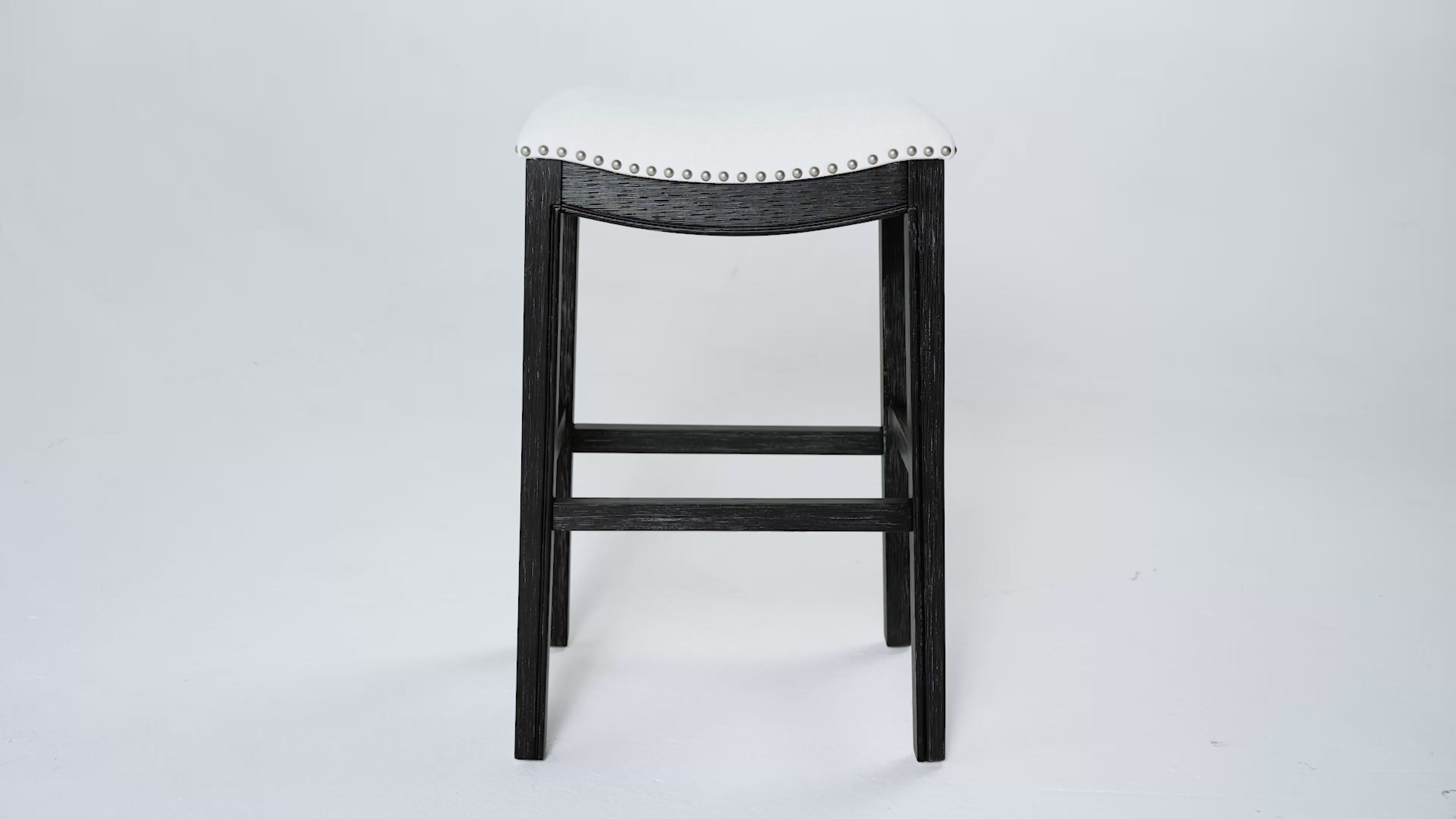 31" Adrien Saddle Bar Stool in Aged Black Finish with Snow White Fabric Upholstery in Stools by Maven Lane