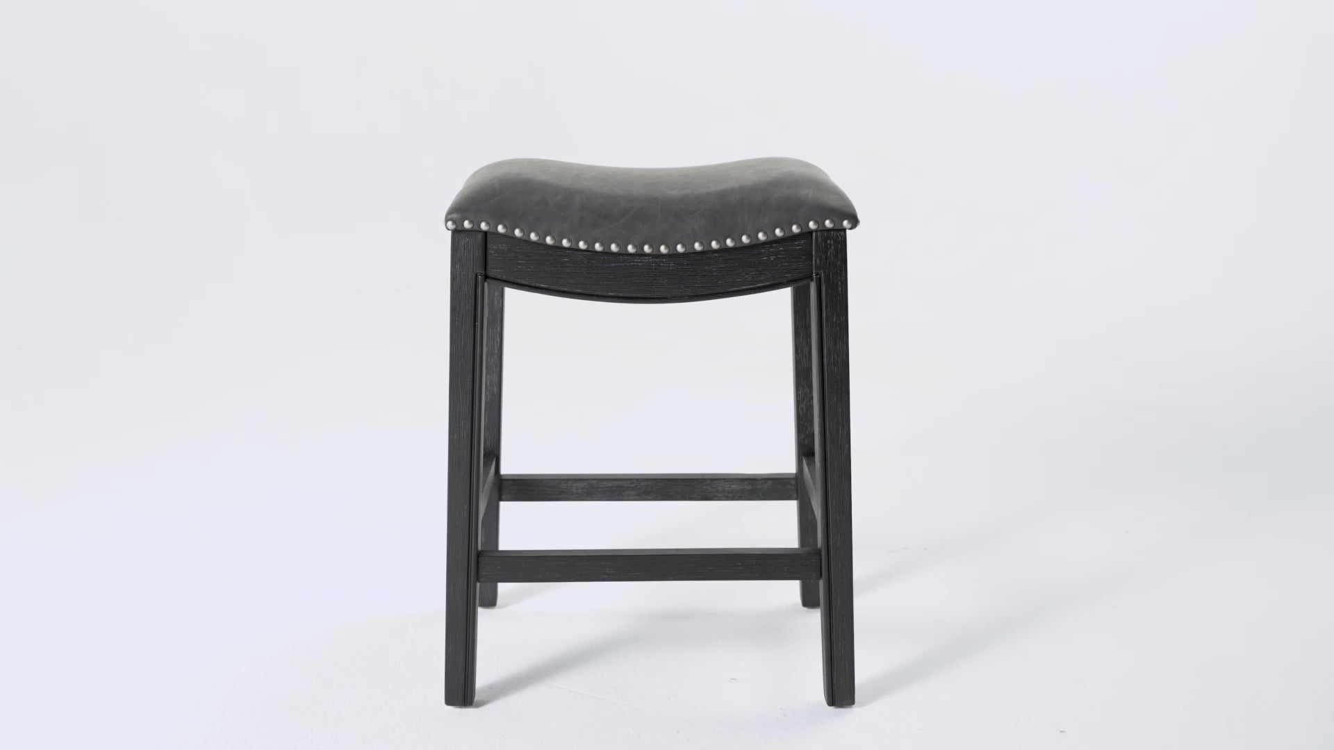 26" Adrien Saddle Counter Stool in Aged Black Finish with Charcoal Black Vegan Leather in Stools by Maven Lane
