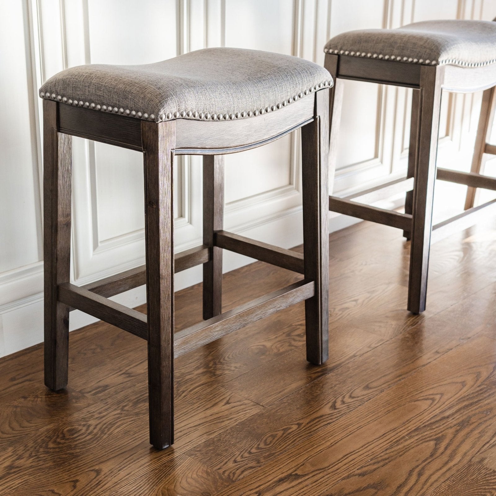 Adrien Saddle Counter Stool in Walnut Finish with Grey Fabric Upholstery in Stools by Maven Lane