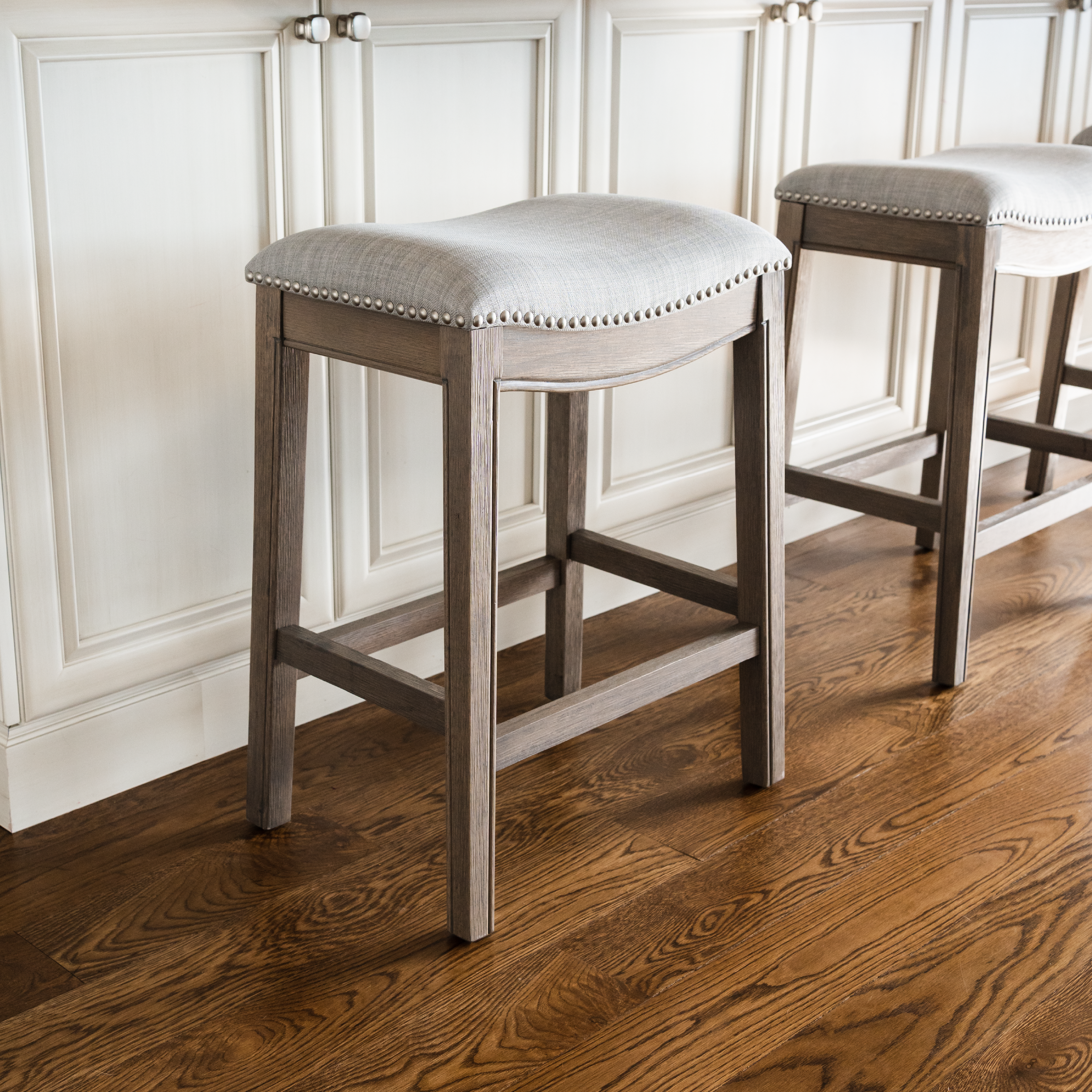 Adrien Saddle Counter Height Kitchen Stool - Reclaimed Oak Finish With Ash Grey Fabric Upholstery in Stools by Maven Lane