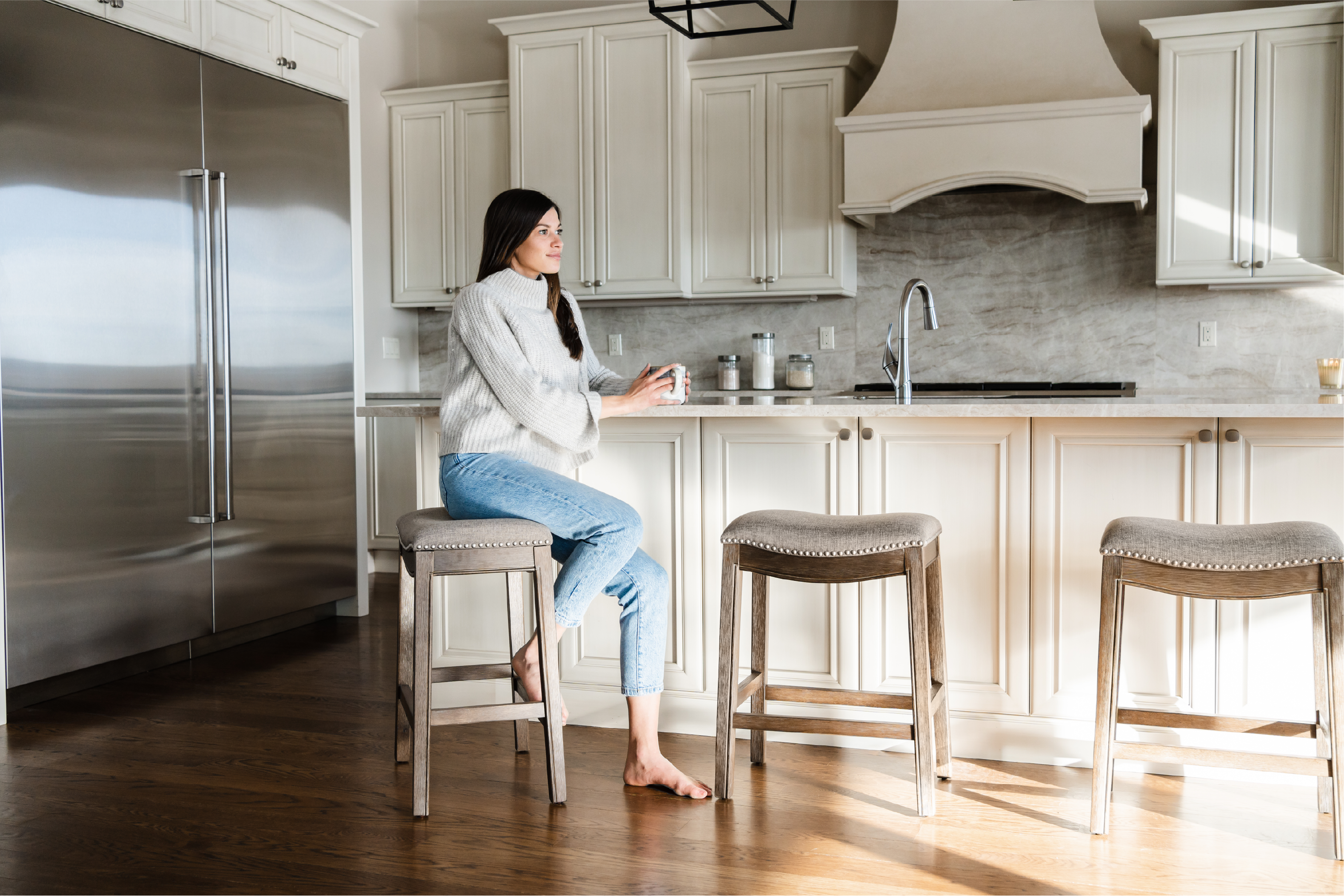 Adrien Saddle Counter Stool in Walnut Finish with Grey Fabric Upholstery in Stools by Maven Lane