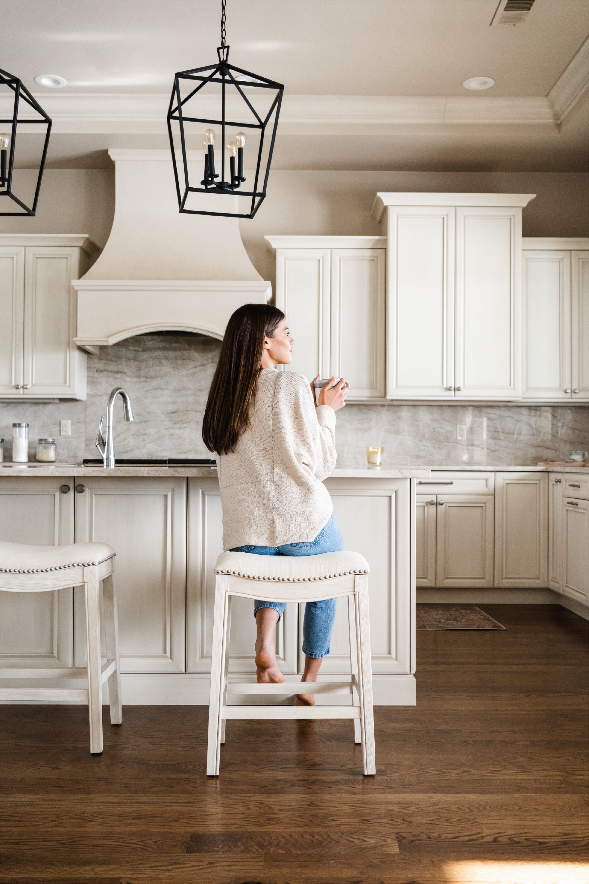 Adrien Saddle Counter Stool In White Oak Finish With Natural Fabric Upholstery in Stools by Maven Lane