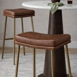 Berkley Bar Height Saddle Stool – Brown Faux Leather & Aged Gold in Maven Lane by Maven Lane