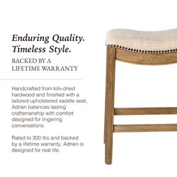Adrien Saddle Counter Stool in Light Brown Finish and Natural Fabric Upholstery in Stools by Maven Lane