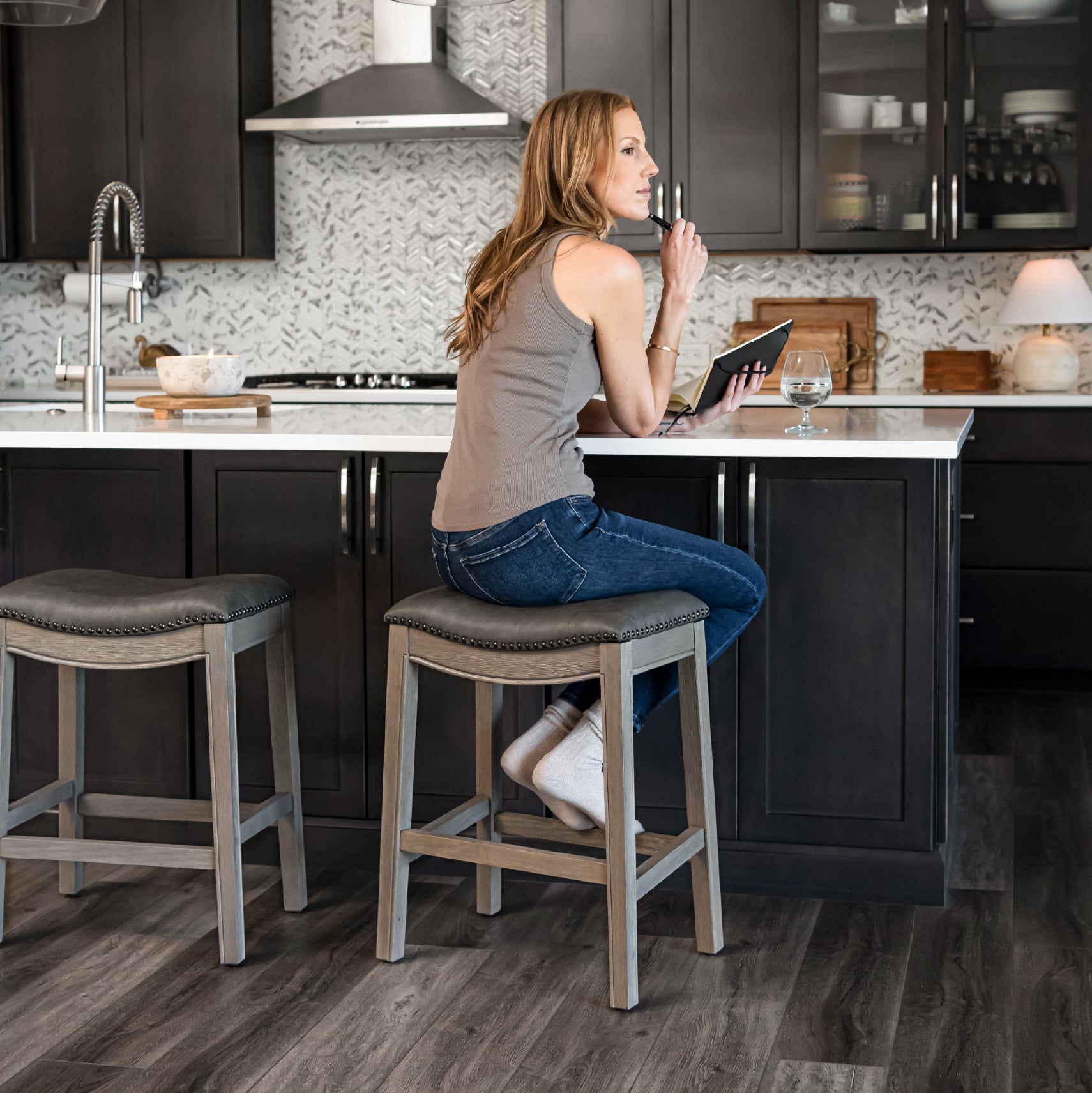 Adrien Saddle Counter Stool in Grey Finish with Grey Faux Leather in Stools by Maven Lane