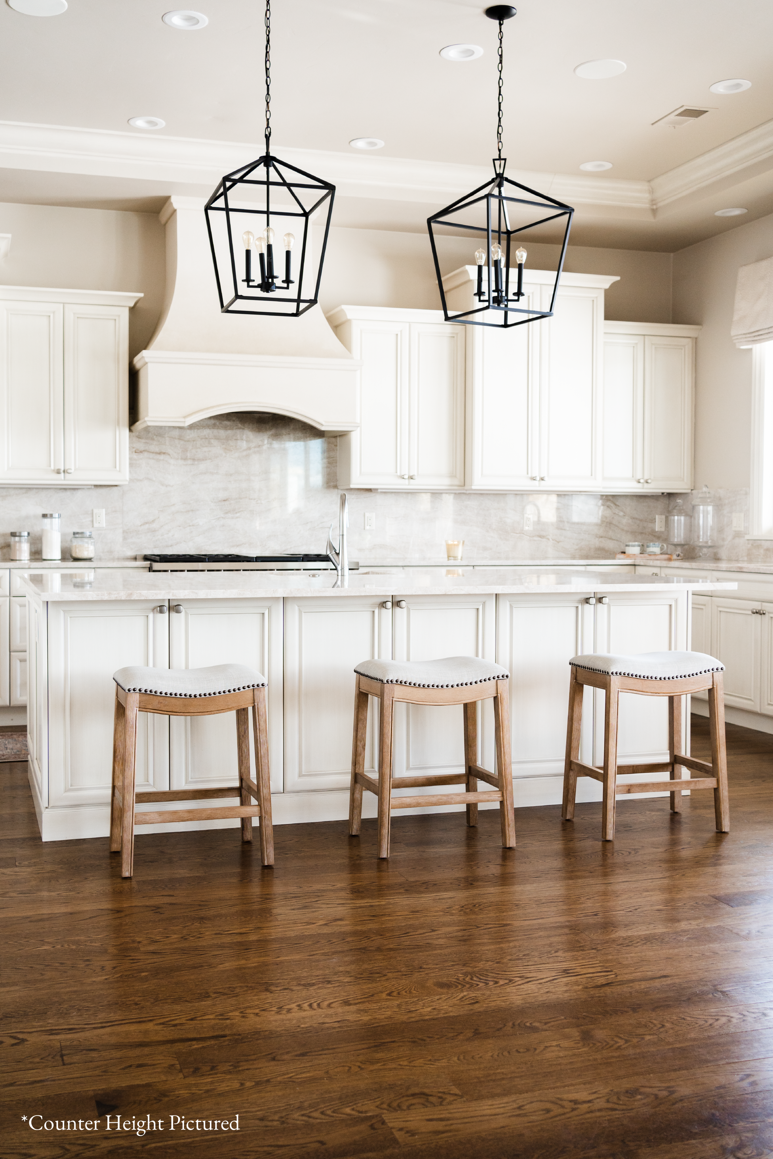 Adrien Saddle Bar Stool In Weathered Oak Finish With Sand Color Fabric Upholstery in Stools by Maven Lane