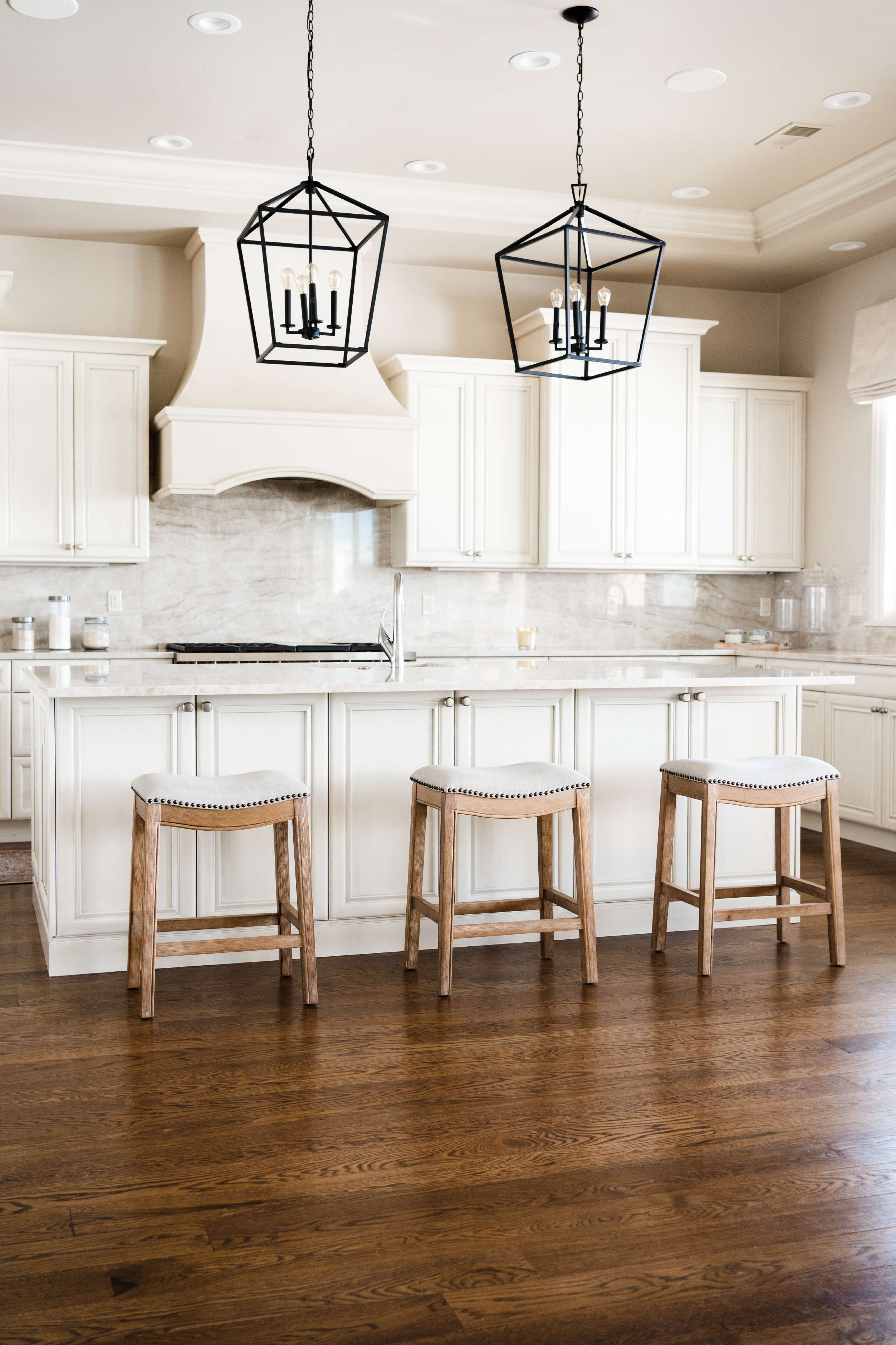 Adrien Saddle Counter Height Kitchen Stool - Weathered Oak Finish With Sand Color Fabric Upholstery in Stools by Maven Lane