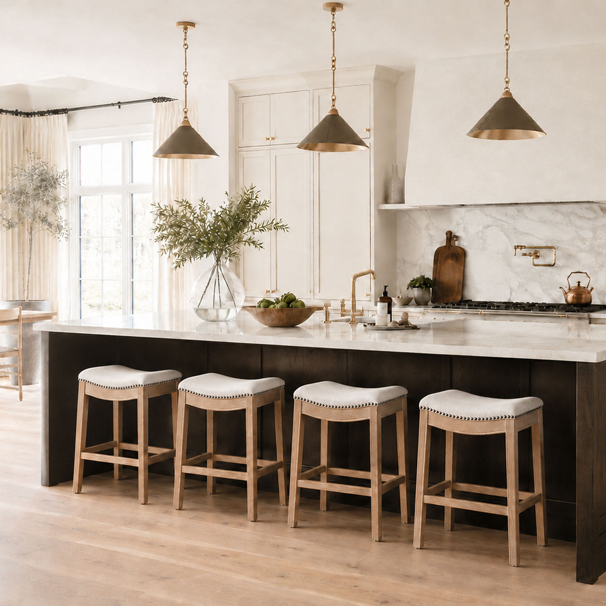 Adrien Saddle Counter Stool in Natural Finish with Light Grey Fabric Upholstery in Stools by Maven Lane