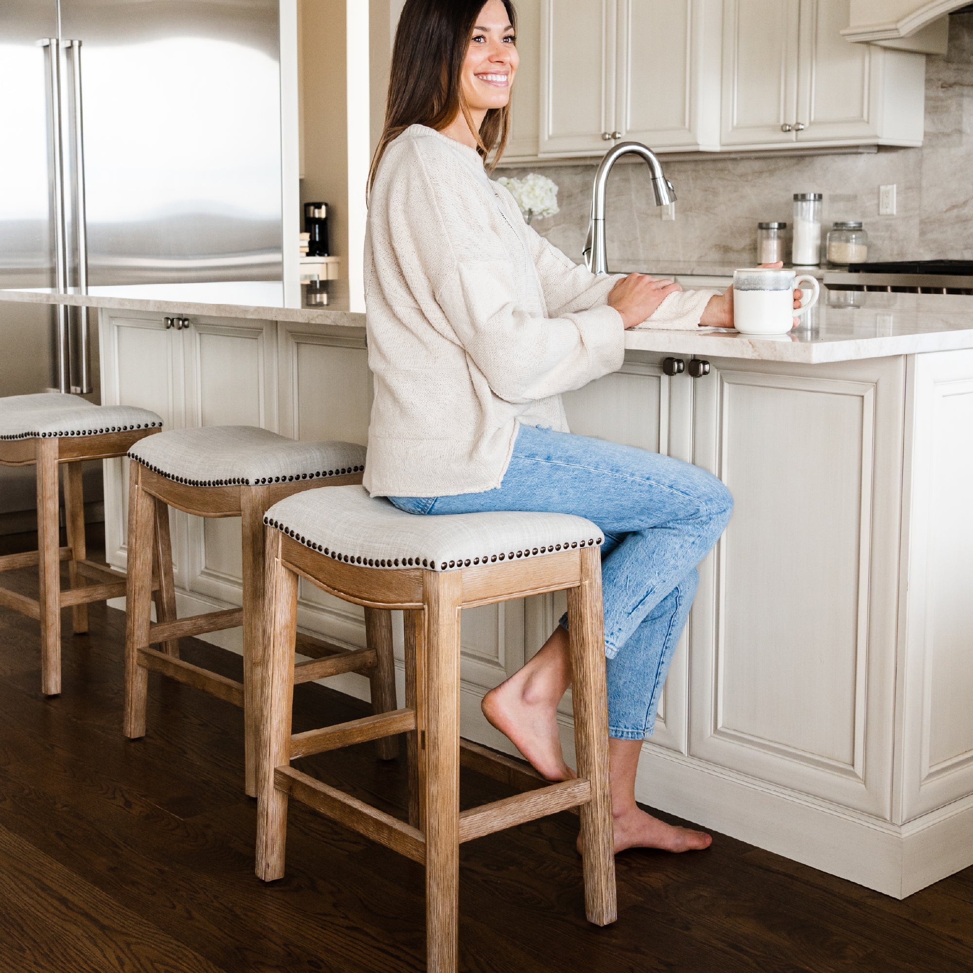 26" Adrien Saddle Counter Stool in Weathered Oak Finish with Sand Color Fabric Upholstery in Stools by Maven Lane