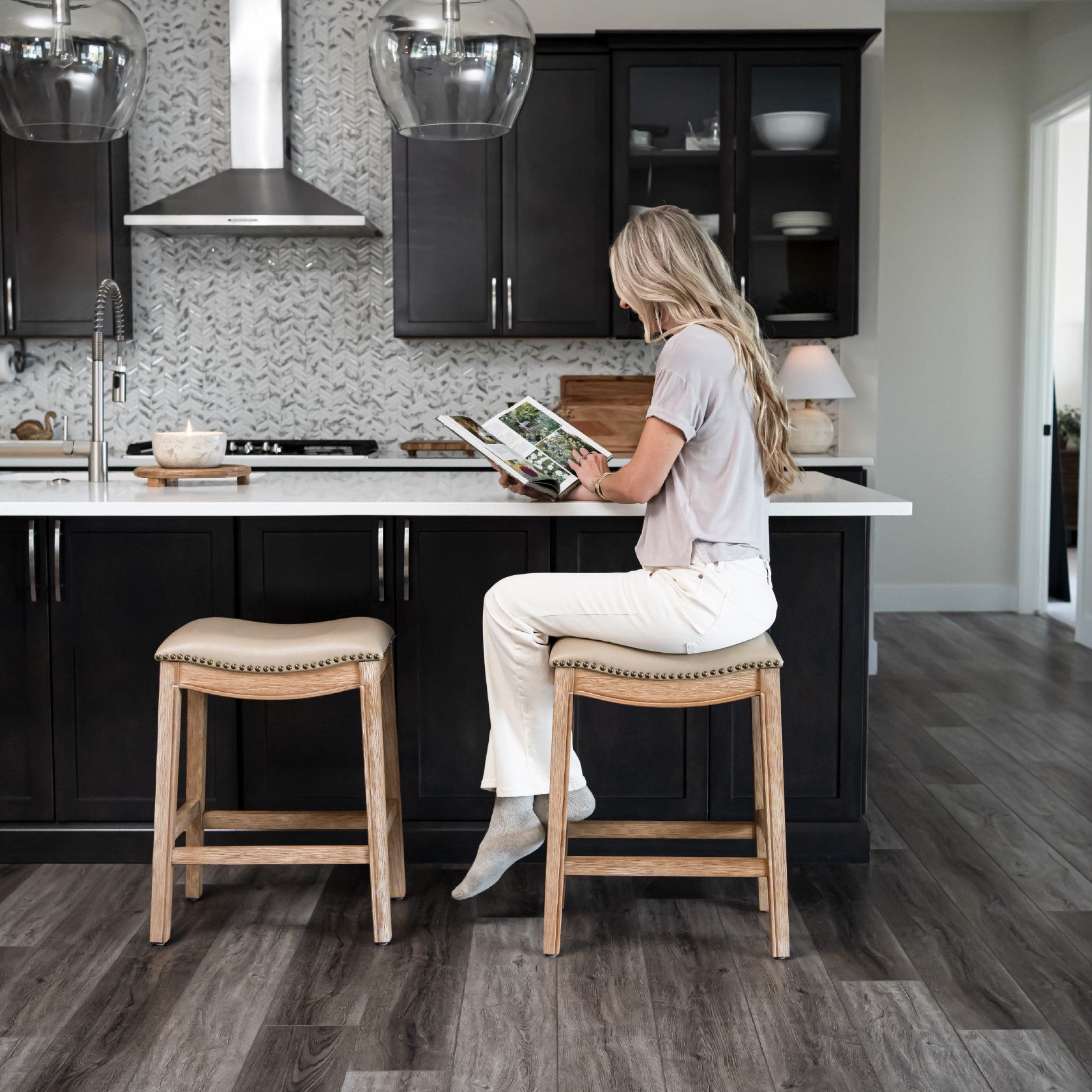 Adrien Saddle Counter Stool in Natural Finish with Beige Faux Leather in Stools by Maven Lane