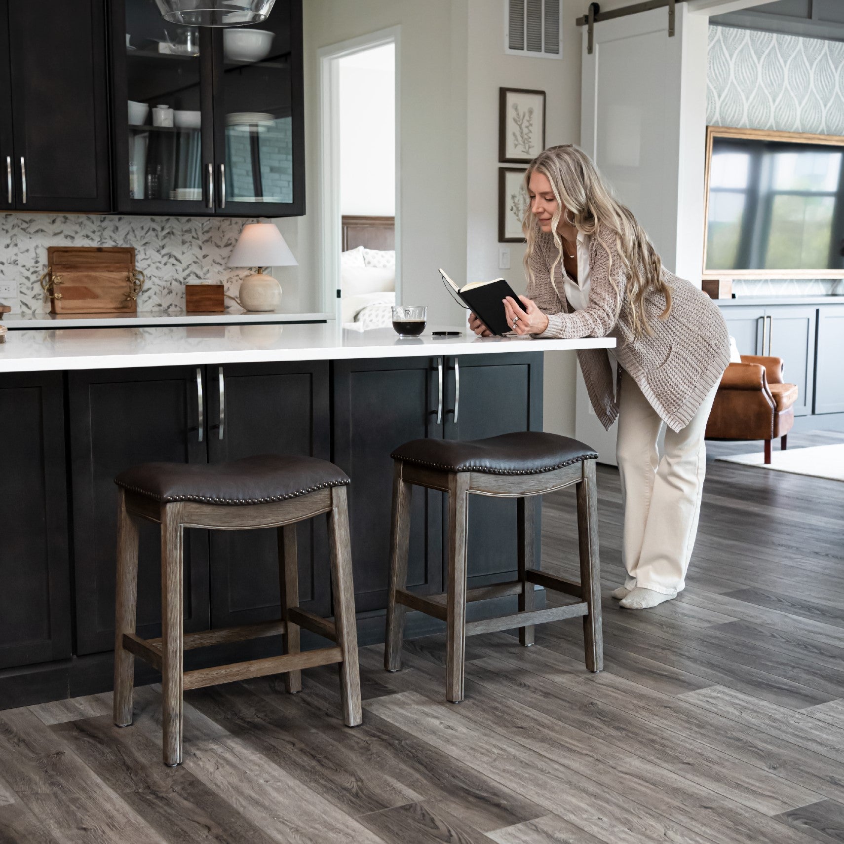 Adrien Saddle Counter Stool in Brown Finish with Dark Brown Faux Leather in Stools by Maven Lane