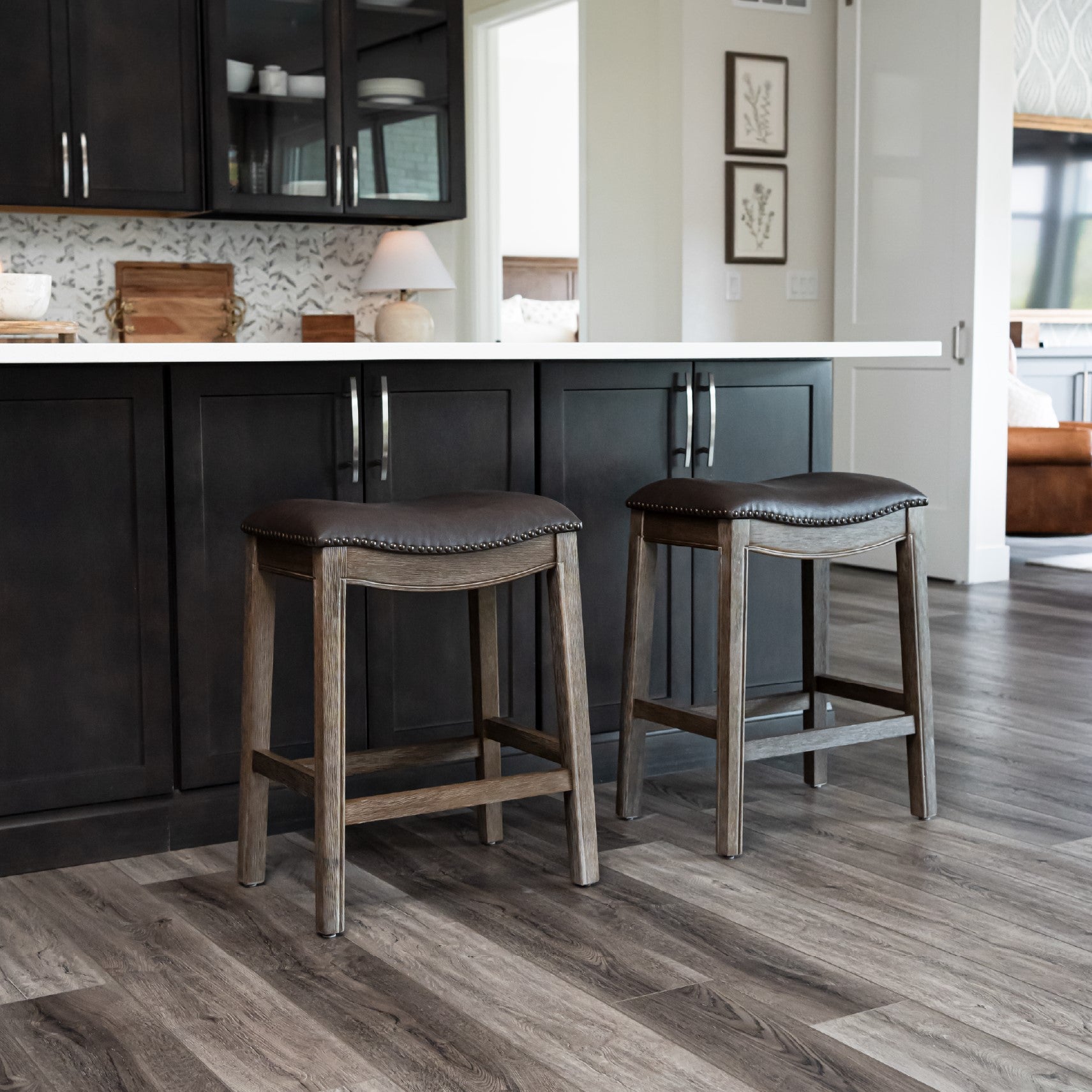 Adrien Saddle Counter Stool in Brown Finish with Dark Brown Faux Leather in Stools by Maven Lane