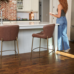 Naomi Counter Stool in Aged Gold Finish with Brown Faux Leather in Stools by Maven Lane