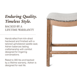Adrien Saddle Counter Stool in Natural Finish with Light Grey Fabric Upholstery in Stools by Maven Lane