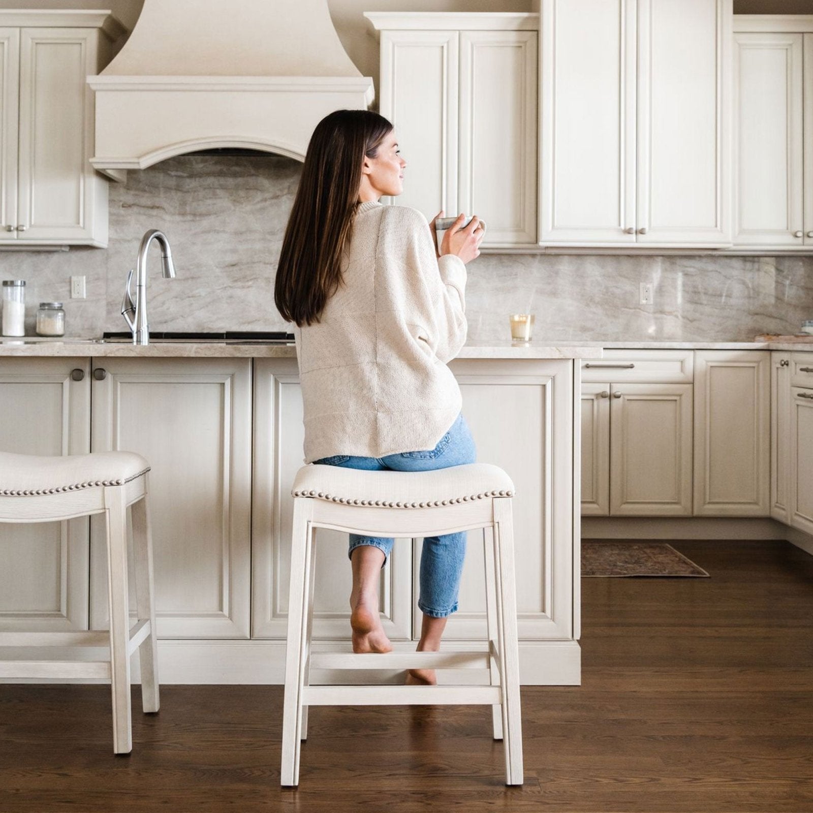 Adrien Saddle Bar Stool In White Oak Finish With Natural Fabric Upholstery in Stools by Maven Lane