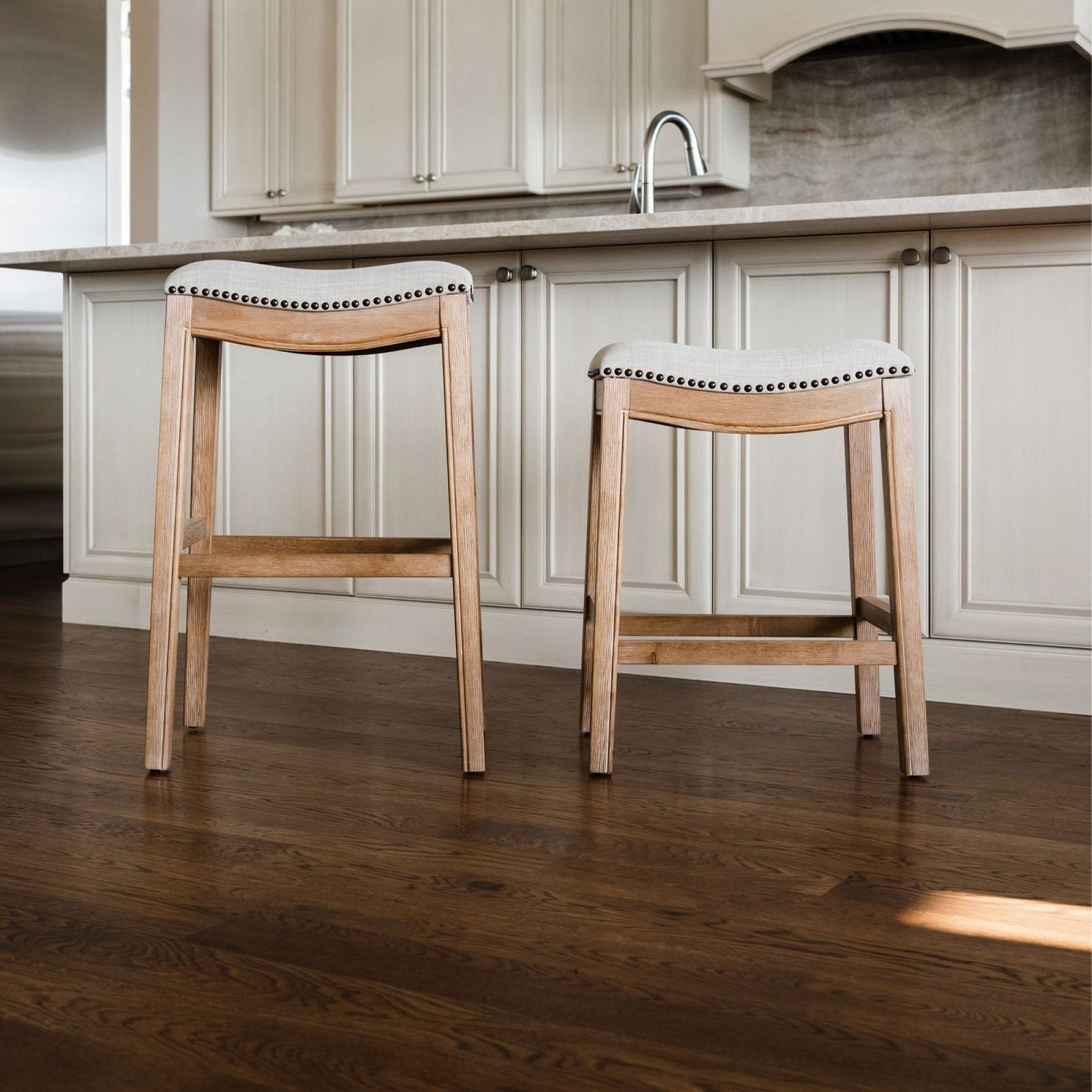 Adrien Saddle Bar Stool In Weathered Oak Finish With Sand Color Fabric Upholstery in Stools by Maven Lane