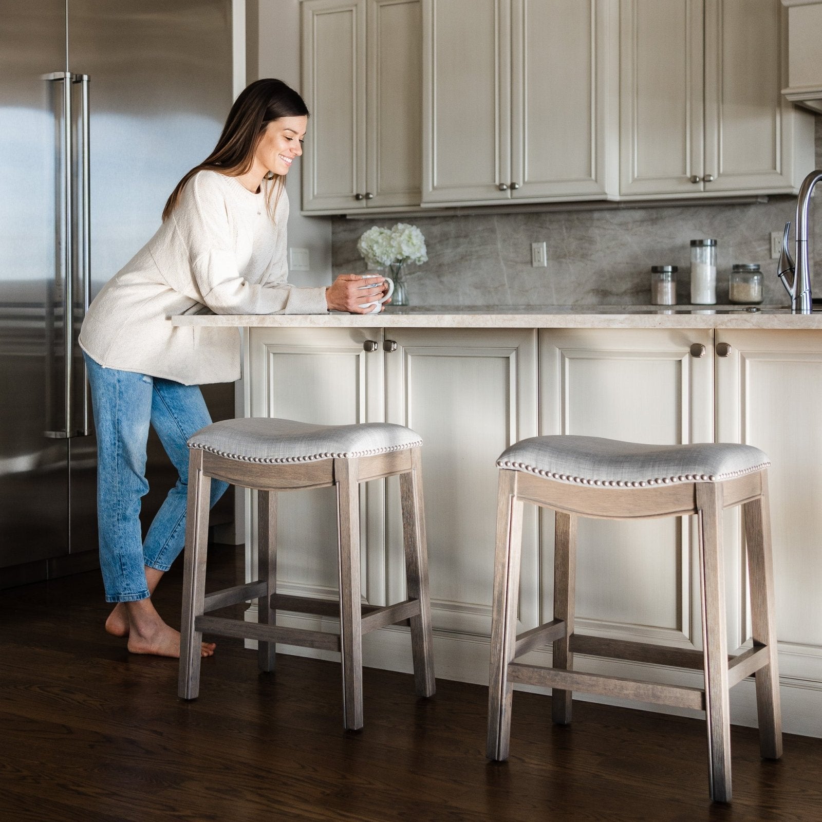 Adrien Saddle Counter Stool In Reclaimed Oak Finish With Ash Grey Fabric Upholstery in Stools by Maven Lane