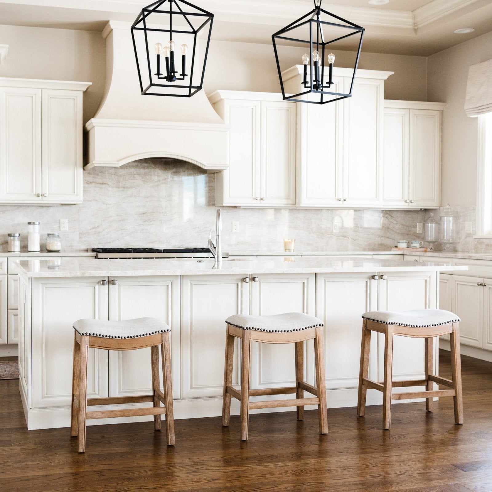 Adrien Saddle Counter Stool In Weathered Oak Finish With Sand Color Fabric Upholstery in Stools by Maven Lane