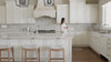 Adrien Saddle Bar Stool in Natural Finish with Light Grey Fabric in Stools by Maven Lane