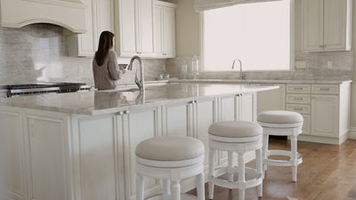 31" Pullman backless swivel bar stool in alabaster white finish with cream fabric upholstery in Stools by Maven Lane