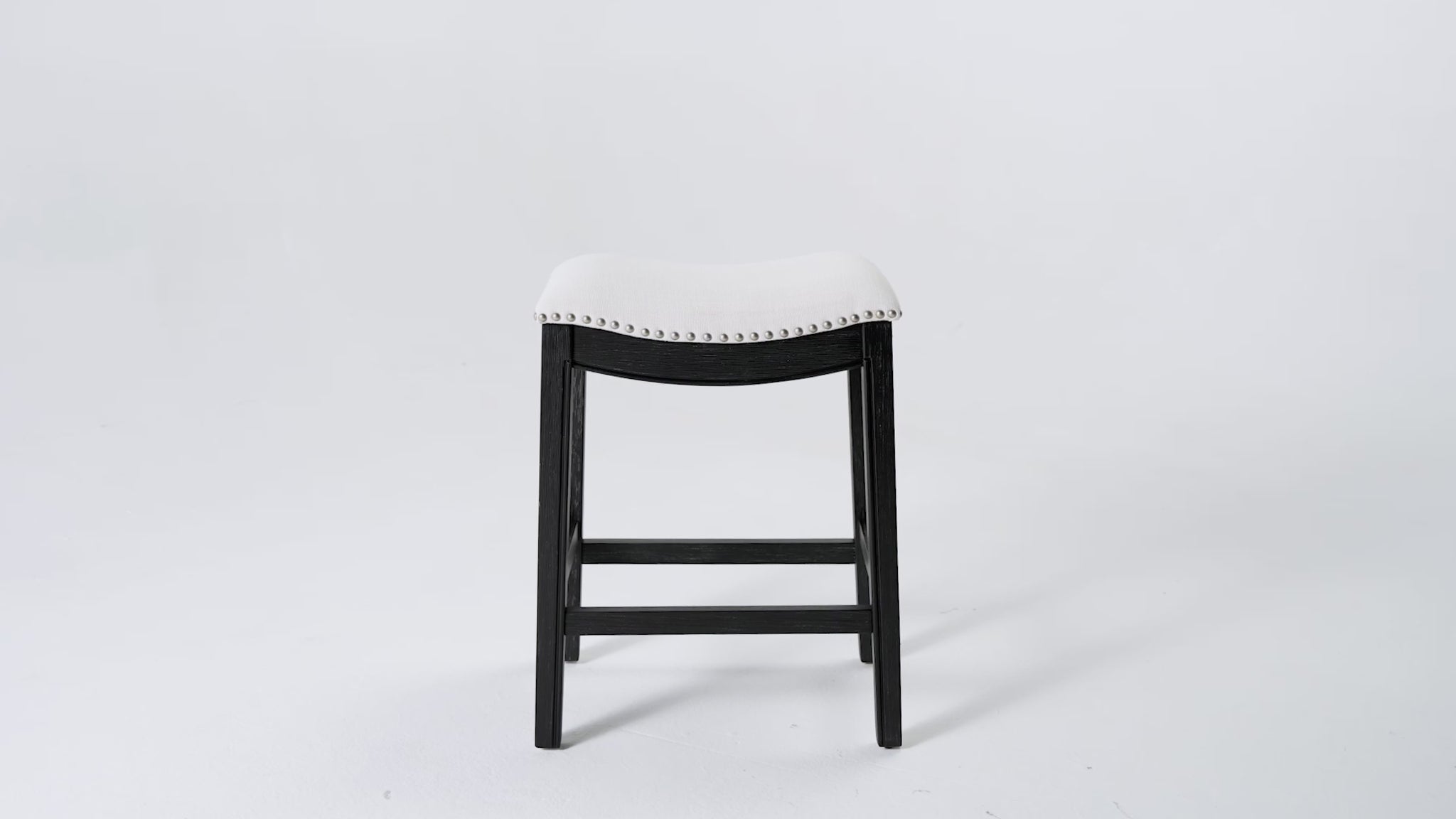 Adrien Saddle Counter Stool in Black Finish with White Fabric in Stools by Maven Lane
