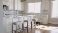 Adrien Saddle Counter Stool in Grey Finish with Grey Fabric in Stools by Maven Lane