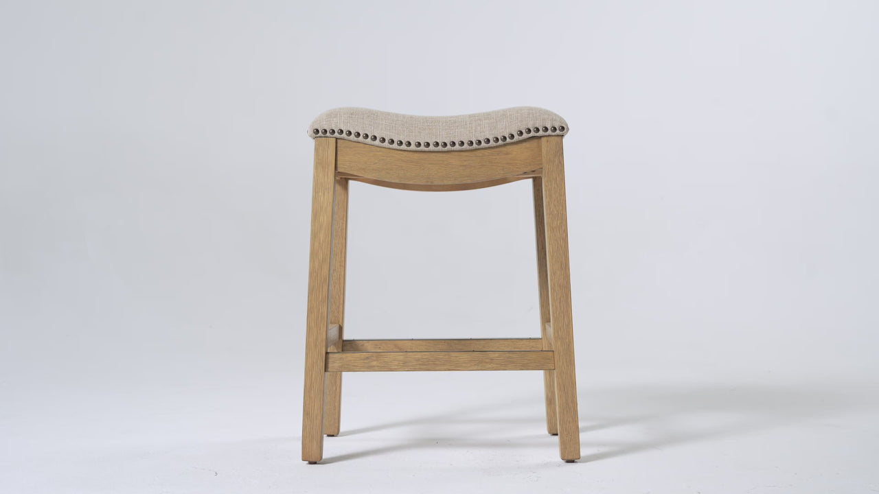 Adrien Saddle Counter Stool in Light Brown Finish and Natural Fabric Upholstery in Stools by Maven Lane