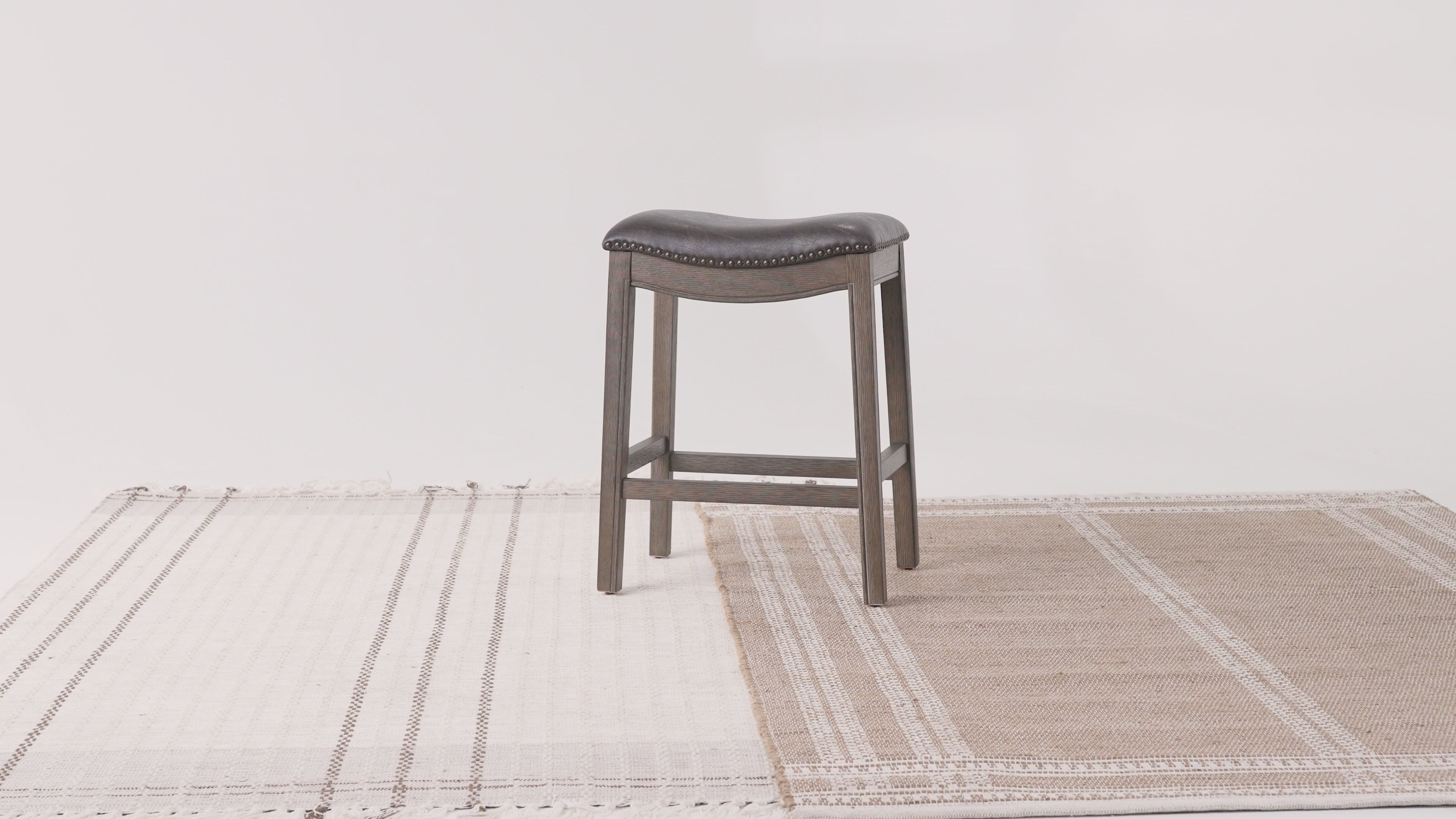 26" Adrien Saddle Counter Stool in Brown Finish with Dark Brown Faux Leather (Set of 3) in Stools by Maven Lane