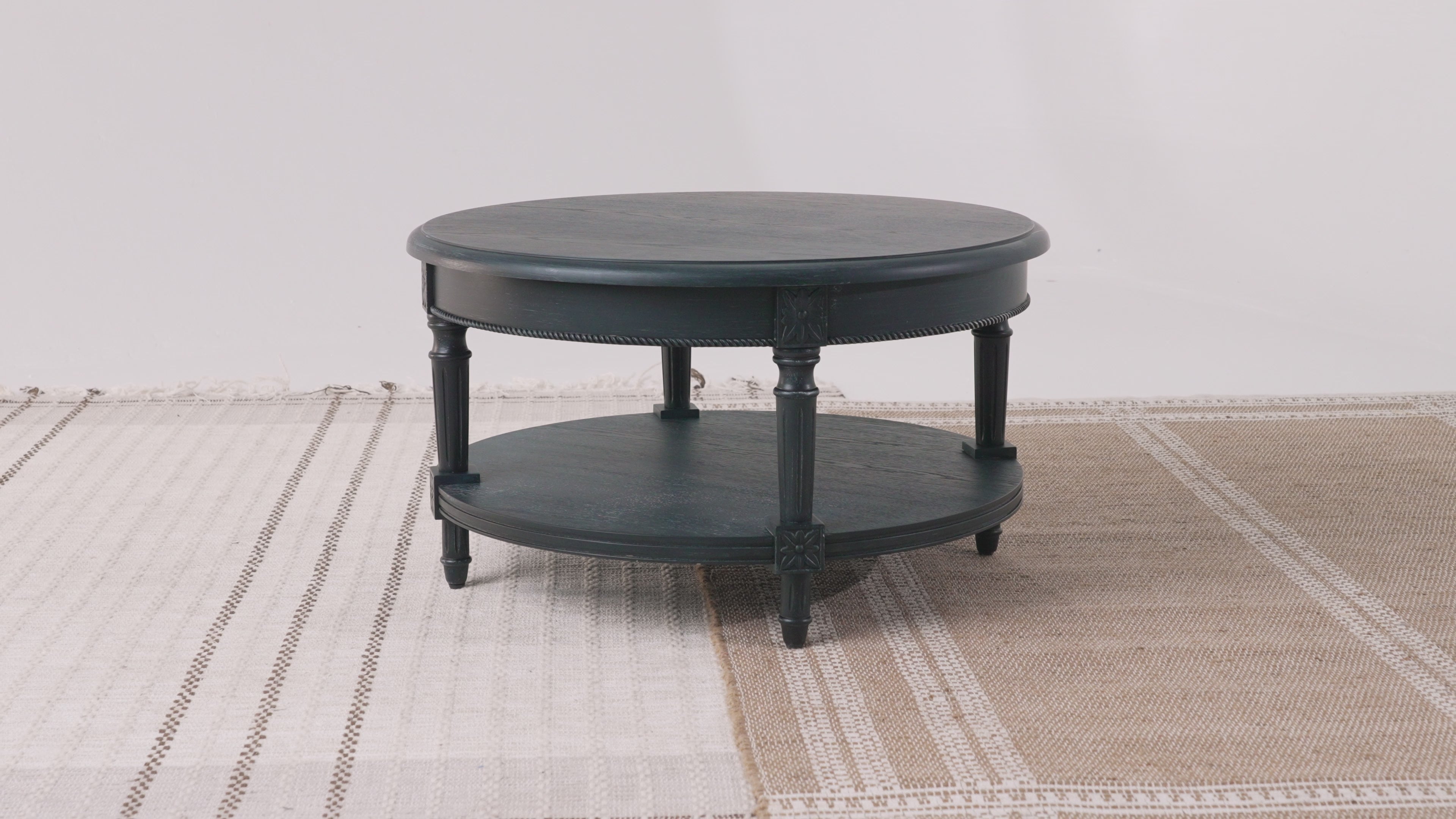Pullman Traditional Round Wooden Coffee Table in Antiqued Black Finish in Accent Tables by Maven Lane