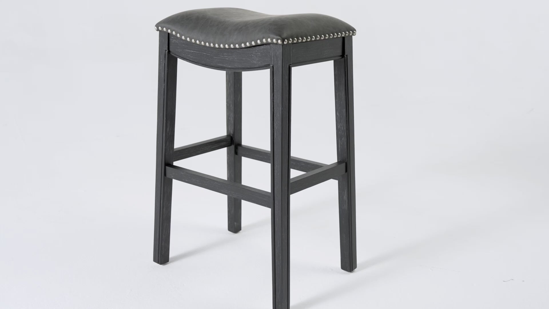 31" Adrien Saddle Bar Stool in Black Finish with Dark Grey Faux Leather (Set of 3) in Stools by Maven Lane