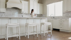 Adrien Saddle Counter Stool in Cream Finish and Cream Fabric in Stools by Maven Lane