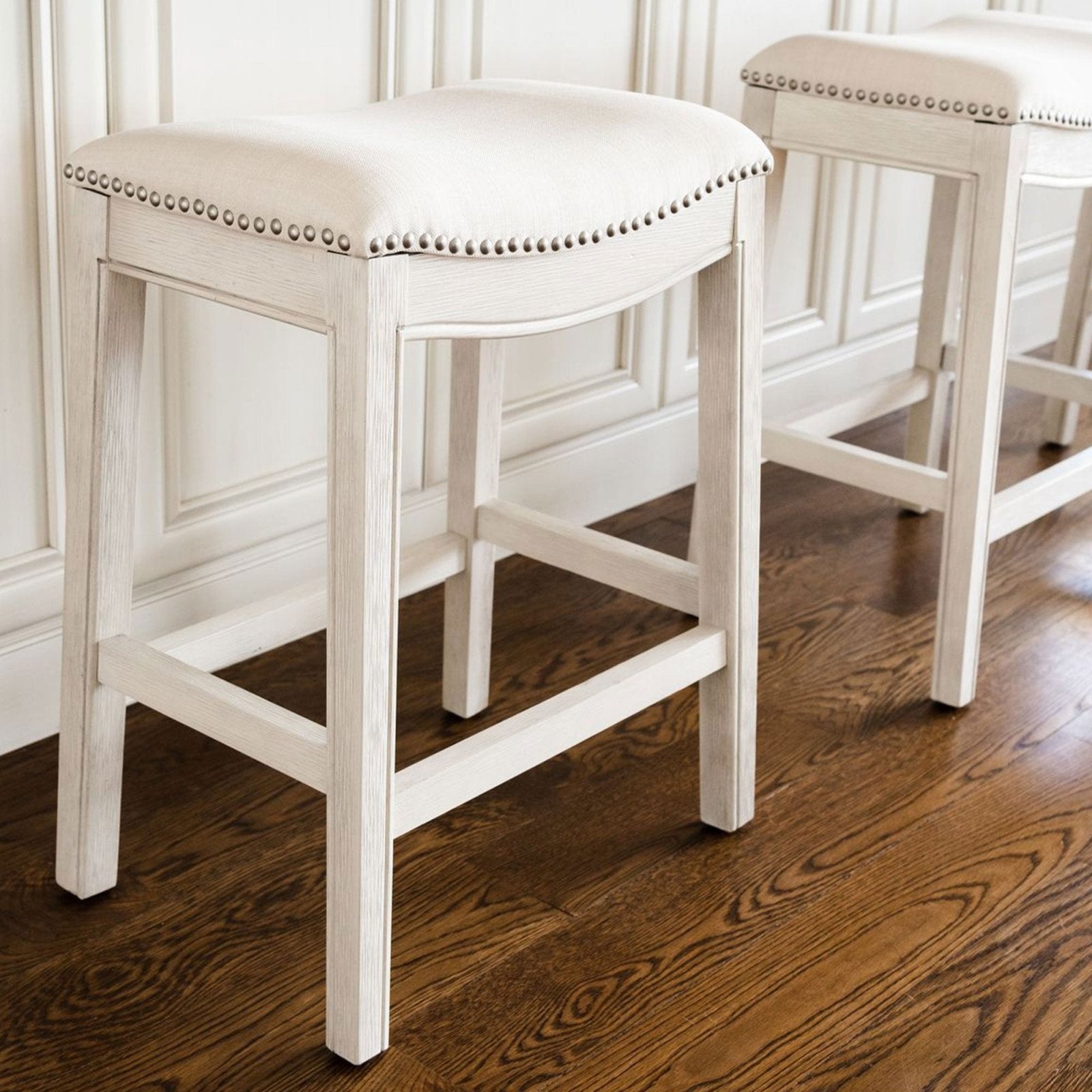 Adrien Saddle Bar Stool in White Oak Finish with Natural Fabric Upholstery in Stools by Maven Lane