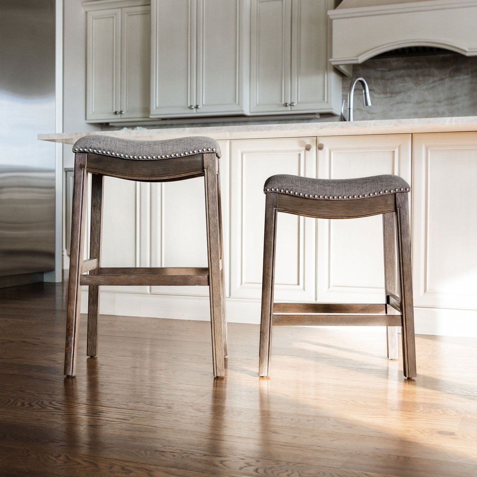 Adrien Saddle Bar Stool in Walnut Finish with Grey Fabric Upholstery in Stools by Maven Lane