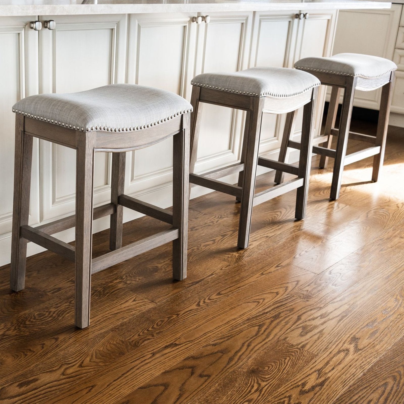 Adrien Saddle Bar Stool in Reclaimed Oak Finish with Ash Grey Fabric Upholstery