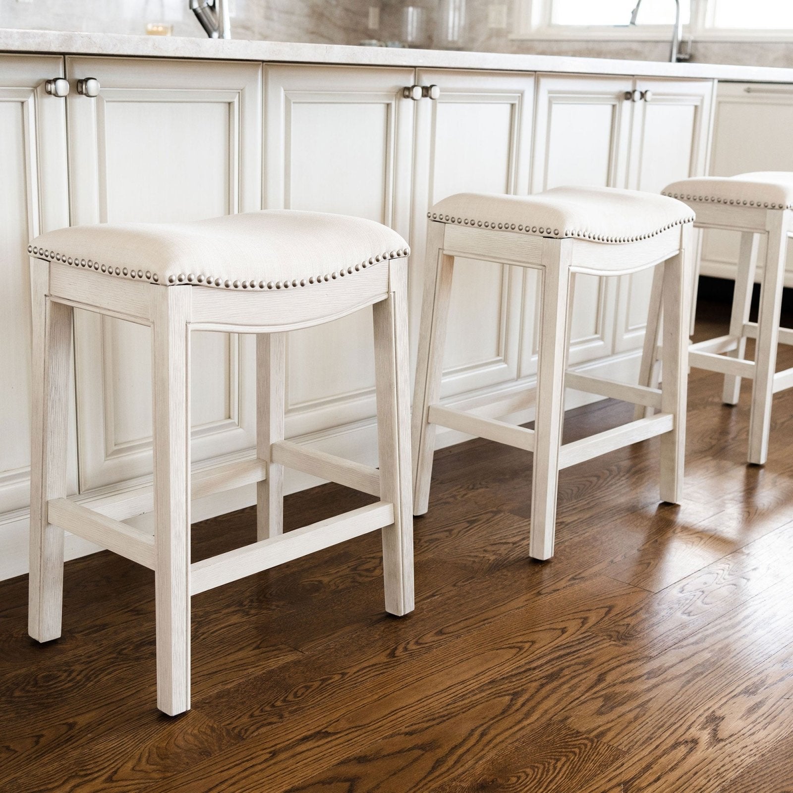 Adrien Saddle Counter Stool in White Oak Finish with Natural Fabric Upholstery